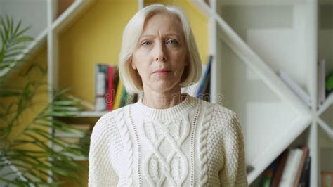 Smiling Middle Aged Mature Grey Haired Woman Looking At Camera Happy