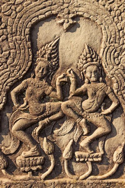 An Intricately Carved Stone Panel Depicting Two People