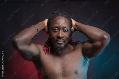Athletic Courageous Black Man With A Naked Torso Hairstyle African Braids Photo In The