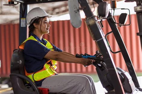 Indian Woman Staff Worker Work Forklift Driver At Port Cargo Warehouse