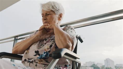 Pensive Sick Disabled Old Lady Sit In Wheelchair Look In Distance Feel