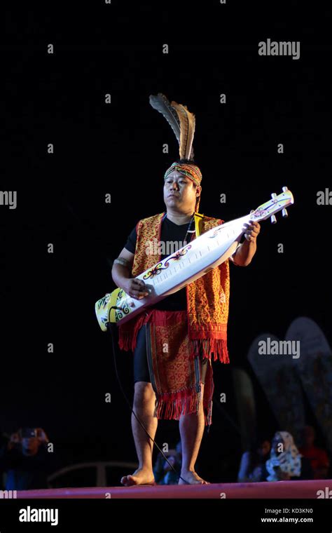 Playing Traditional Musical Instrument From Sarawak Malaysia Stock