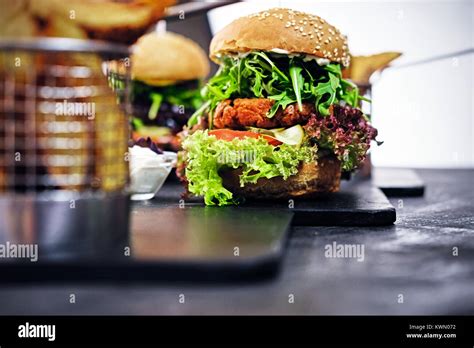 Burger Fries With Salad On A Table Stock Photo Alamy