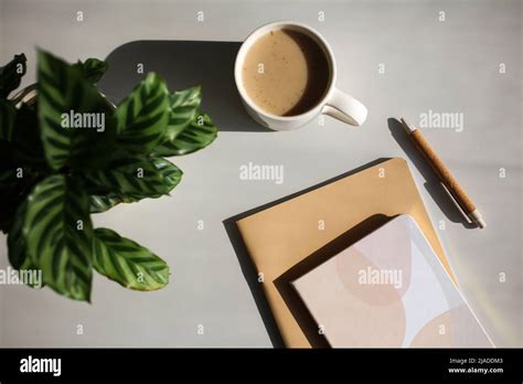 Aesthetic Home Office Desk Table With Cup Of Coffee Paper Notebooks