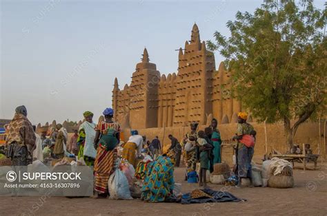 People At The Colorful Weekly Market In Front Of The Great Mosque Of