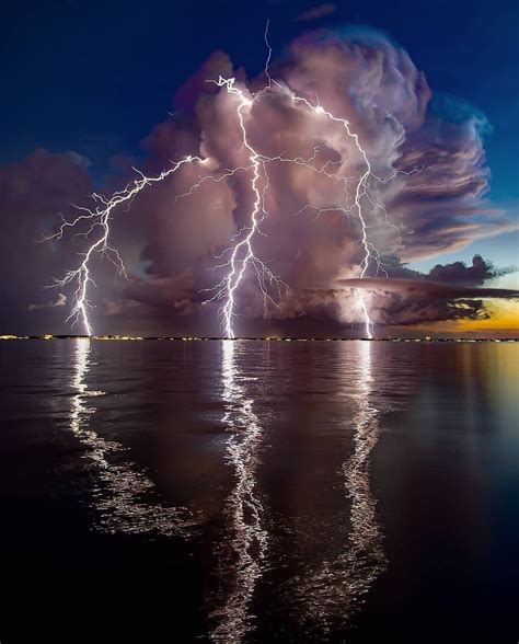 Lightning reflection on ocean : r/pics