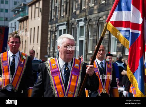 Office Bearers Of The Orange Lodge Marching At The Annual Orange Walk