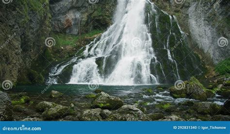 Mountain River Flows Down In The Forest Clear Water Foam And Splash On