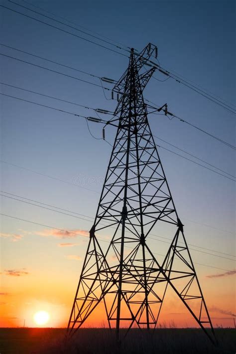 Silhouette High Voltage Electric Towers At Sunset Time High Voltage