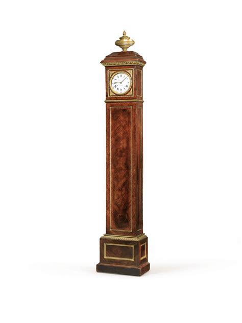 A Louis Xvi Gilt Bronze Mounted Mahogany And Tinted Wood Regulator