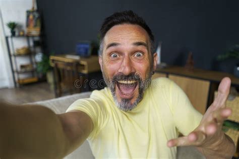 Happy Handsome Middle Aged Man Taking Selfie Sitting On The Couch Sofa