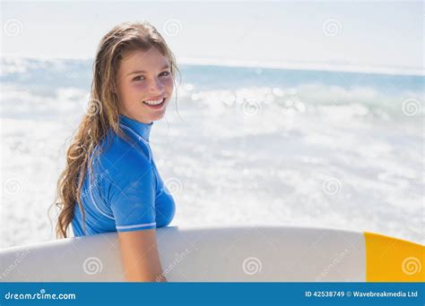 Fit Happy Surfer Girl On The Beach With Her Surfboard Stock Image