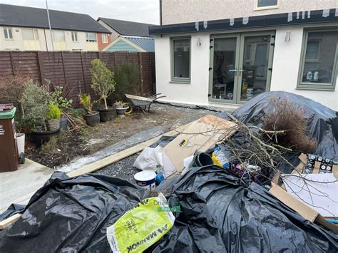 Patio With Quartz Slabs Rustic Slane Border And Roll On Turf In