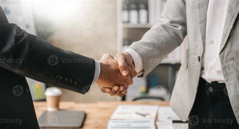 Two Confident Business Man Shaking Hands During A Meeting In The Office