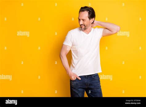 Photo Of Handsome Mature Attractive Man Hold Hand Neck Look Empty Space