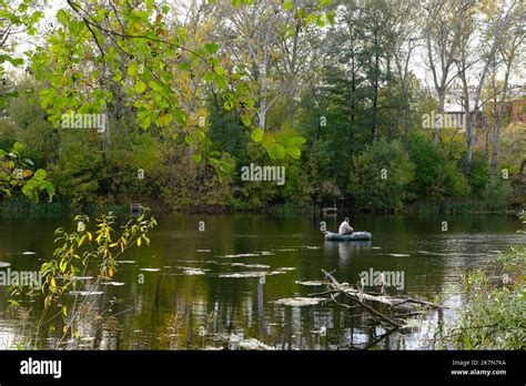 Mature Man Fishing On The River From Inflatable Boat Stock Photo Alamy