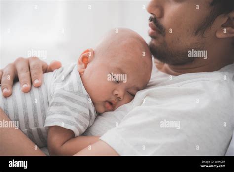 Cute Baby Boy Sleeping On Father S Chest Stock Photo Alamy