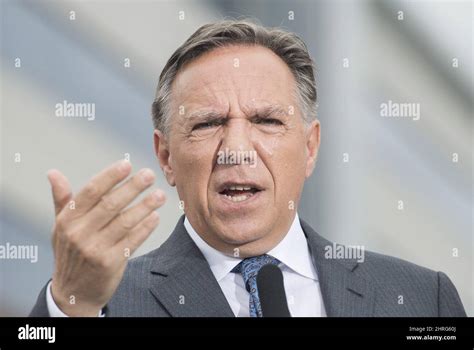 CAQ leader Francois Legault speaks to reporters during a campaign stop ...