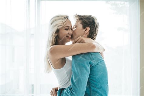 Free Photo Happy Couple Playing Together In The Bedroom