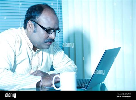 Indian Man Working In Office Stock Photo Alamy