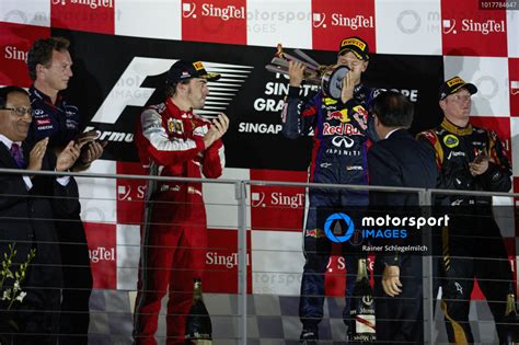 Sebastian Vettel 1st Position Celebrates On The Podium Alongside Fernando Alonso 2nd Position