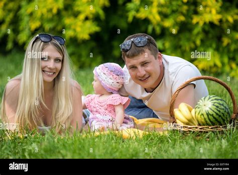 Portrait Of Happy Family In Garden Stock Photo - Alamy