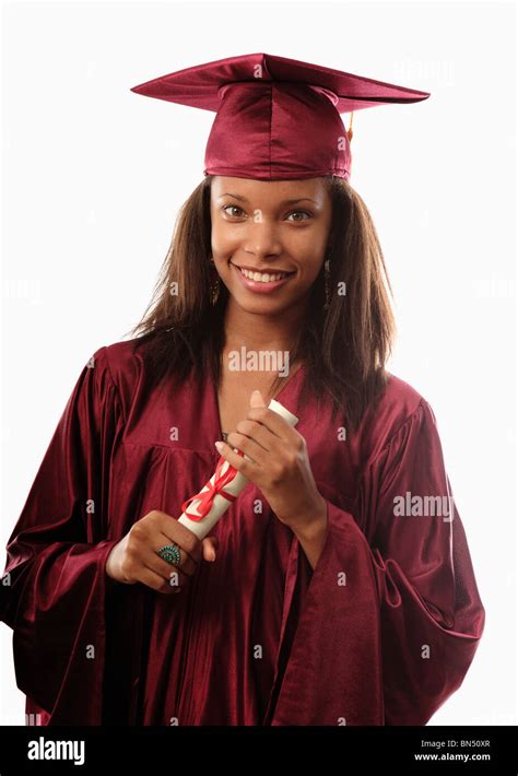 Female College Graduate In Cap And Gown With Diploma Stock Photo Alamy