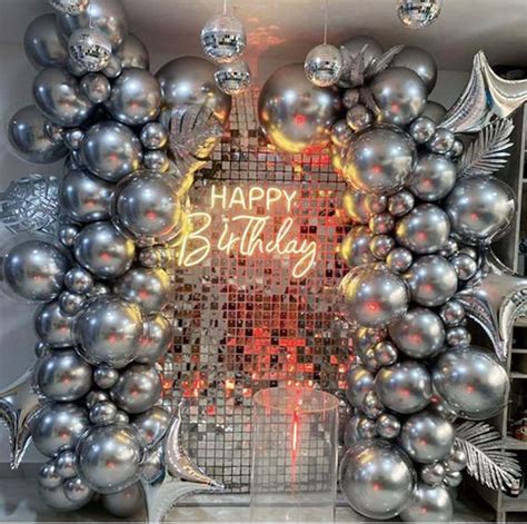 Silver Balloons Arranged For A Photo Back Drop Chrome Hearts Theme