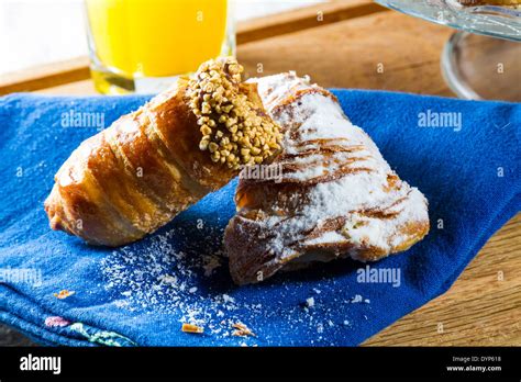 Typical Continental Breakfast With Sugar Coated Cannoli And Croissants