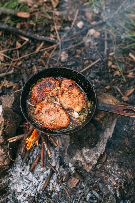 Frying Meat In A Pan Over An Open Fire With Leek Steak In A Pan On A