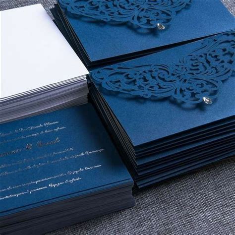 Several Blue Cards Stacked On Top Of Each Other With White Envelopes In