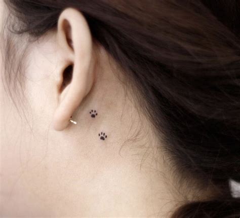 Discrete Paw Print Tattoo Behind Ear