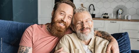 Smiling Gay Man Hugging Mature Partner At Home Banner Stock Photo Adobe Stock