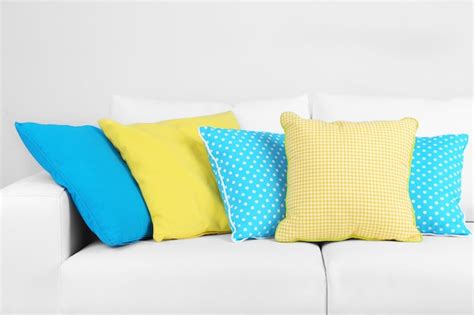 Premium Photo | White sofa with colorful pillows in room