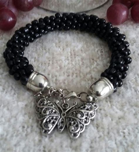 Basic Black Beaded Kumihimo Bracelet With A Charming Antique Butterfly