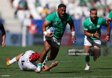 Bundee Aki Of Ireland Breaks Away From Adrian Motoc Of Romania During