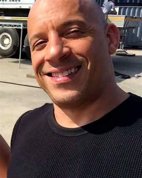 A Balding Man Smiles At The Camera