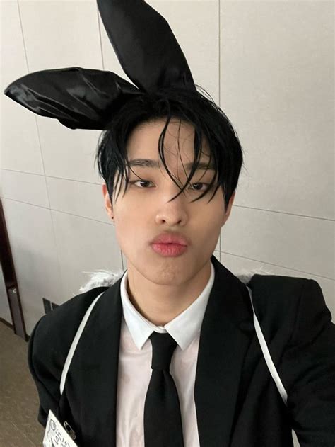 A Man In A Suit And Tie With Bunny Ears On His Head