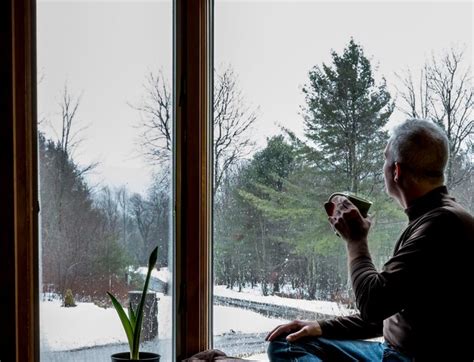 Premium Photo Side View Of Mature Man With Coffee Sitting On Window Sill