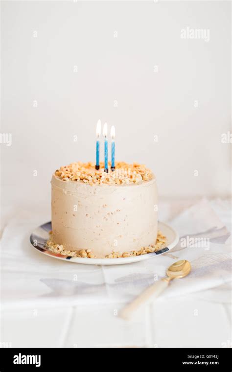 Birthday cake with three candles Stock Photo - Alamy