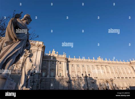 Statues In Plaza De Oriente With Palacio Real De Madrid Royal Palace