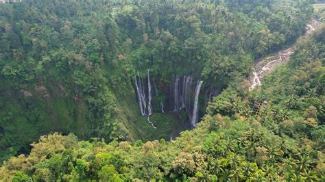 Aerial View Of Tumpak Sewu Waterfall And Semeru Mountain At Sunrise