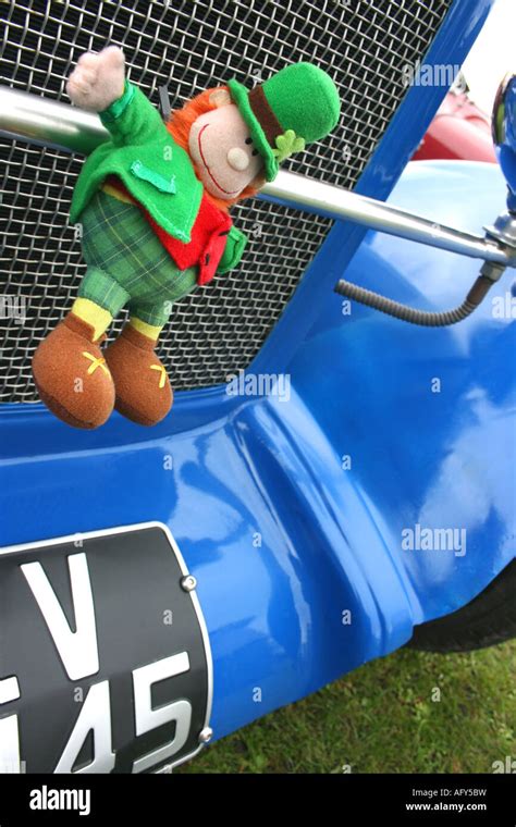 Lucky Irish leprechaun mascot on badge bar of car Stock Photo - Alamy