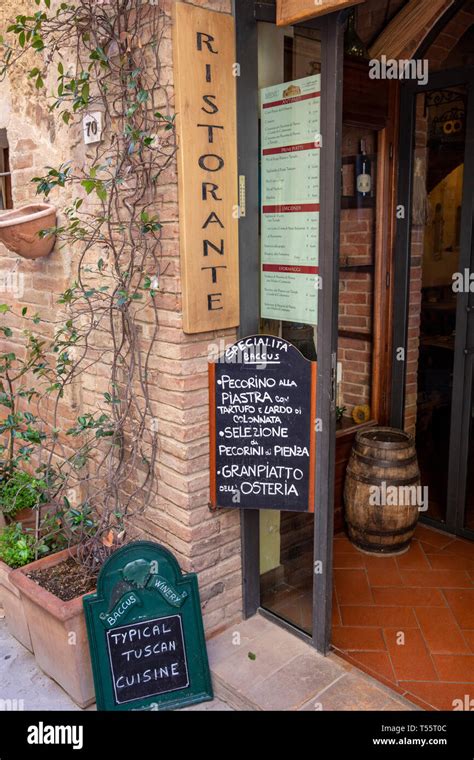 Traditional italian restaurant entrance in the village of Pienza ...
