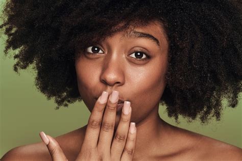 Premium Photo African American Woman Covering Mouth