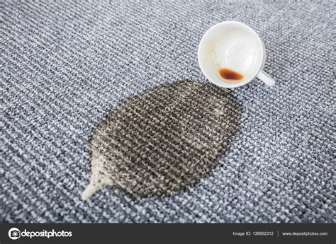 Coffee Spilled On Carpet — Stock Photo © AndreyPopov #138902312