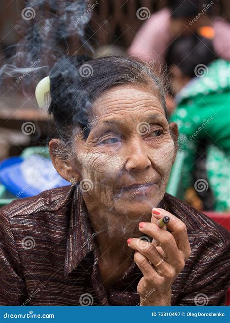 Older Lady Sitting on the Street Smoking a Cigarette. Yangon, Myanmar ...