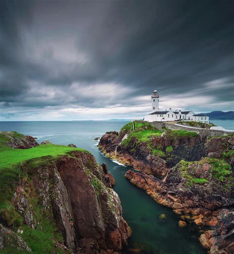 Dark Clouds Move Over The Fanad Head Lighthouse In Ireland Photograph