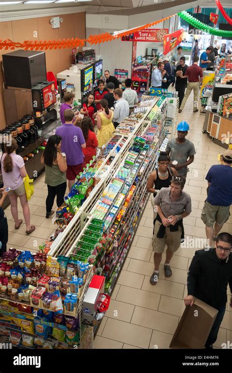 Hordes Of Customers Line Up For Their Free Slurpees In A 7 Eleven Store