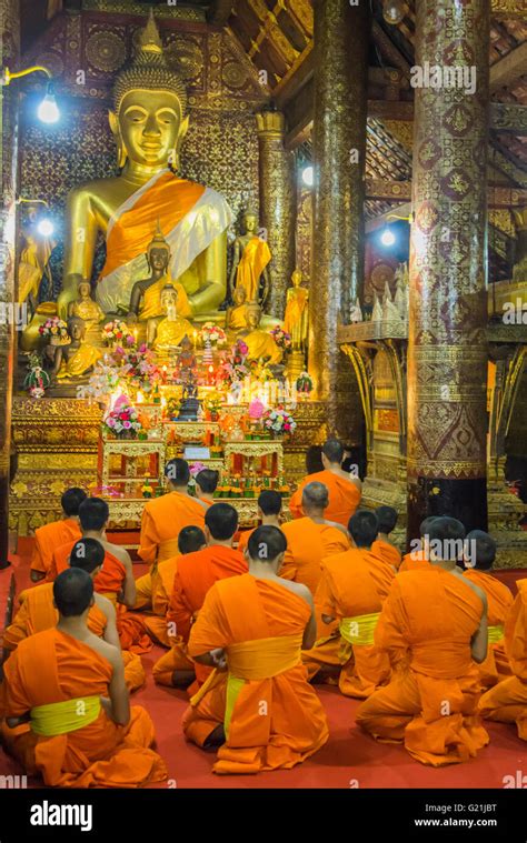 Buddhist Monks Praying In The Temple Wat Xieng Thong Luang Prabang